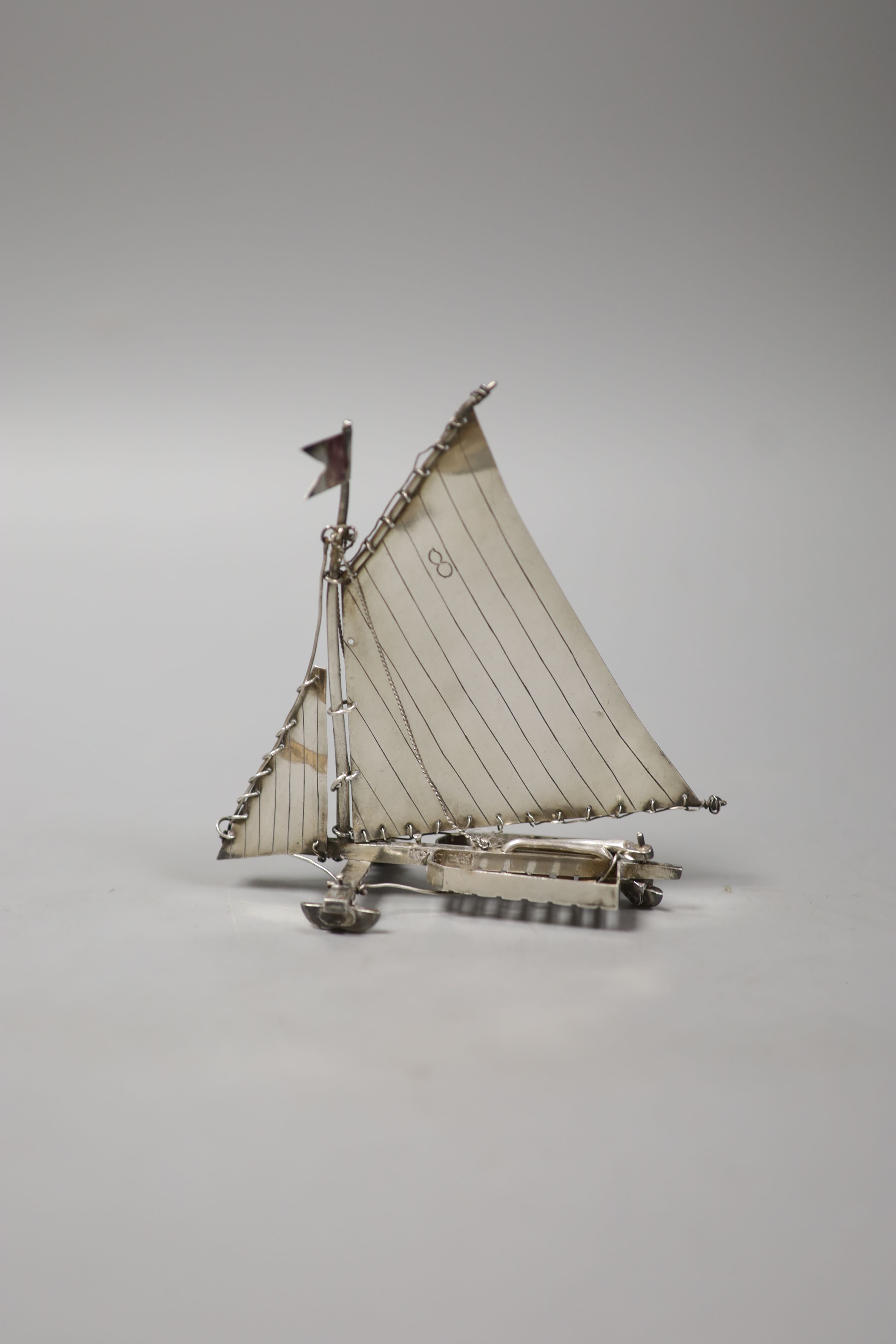 A continental miniature white metal and enamel model of an ice yacht, height 12.5cm, gross 85 grams.